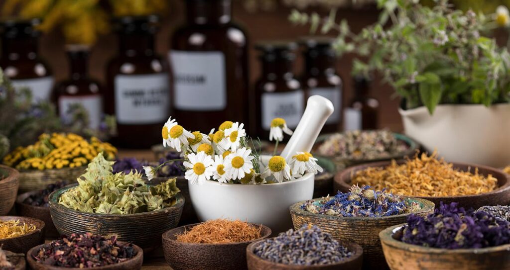 Herbs medicine and vintage wooden background